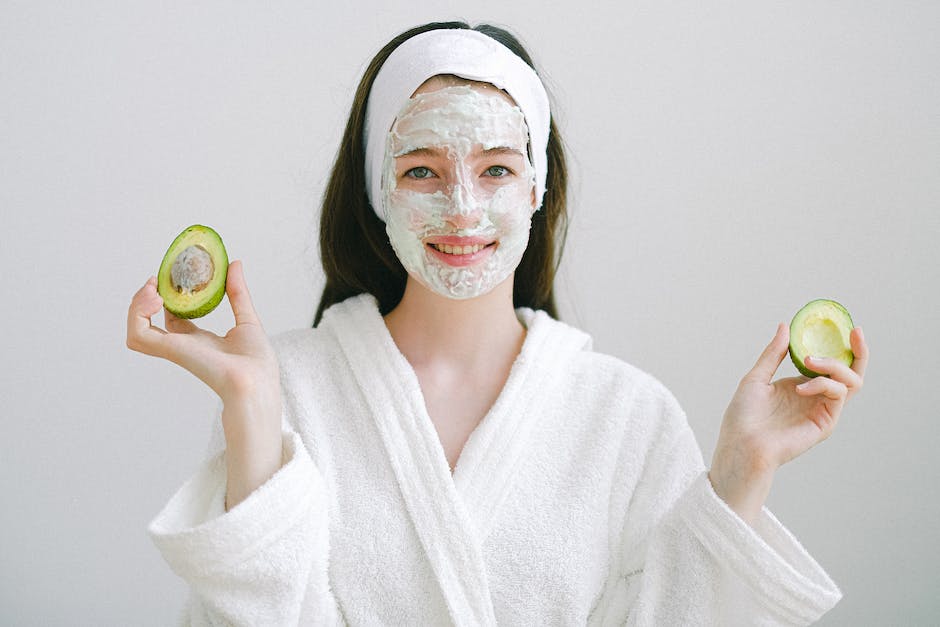 Image of a person applying avocado hair mask to their hair.