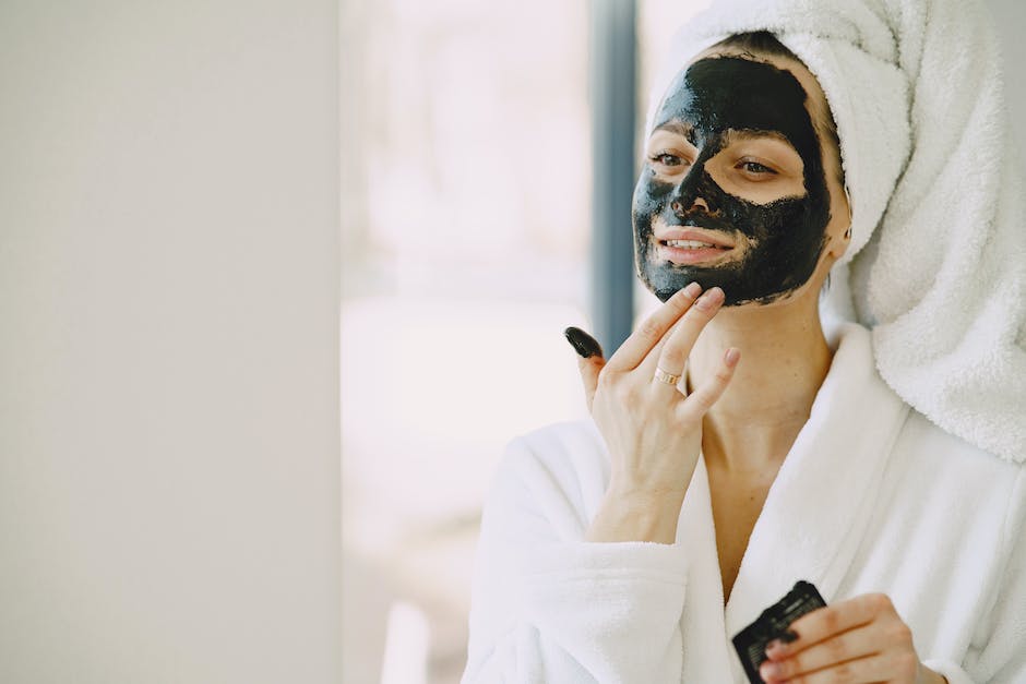 Image of a woman applying homemade face scrub, emphasizing the use of natural ingredients for skincare